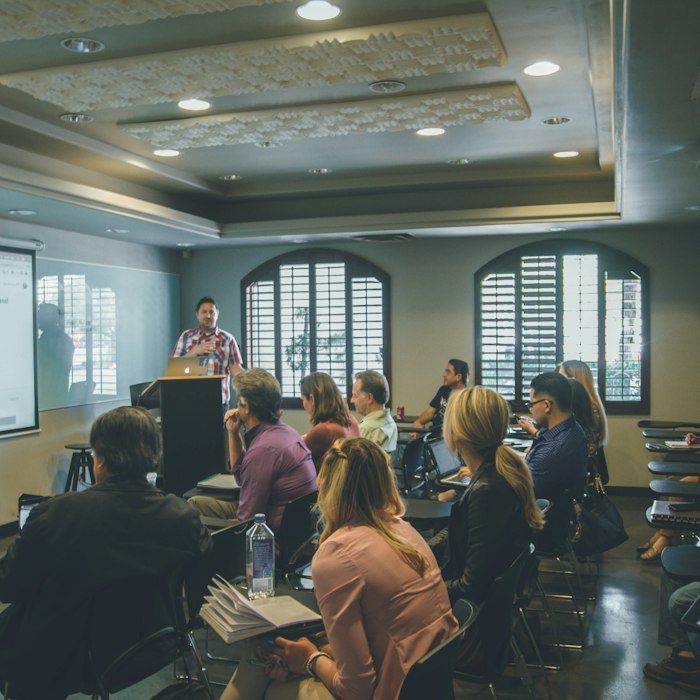 Trainer presenting to a group during a live workshop